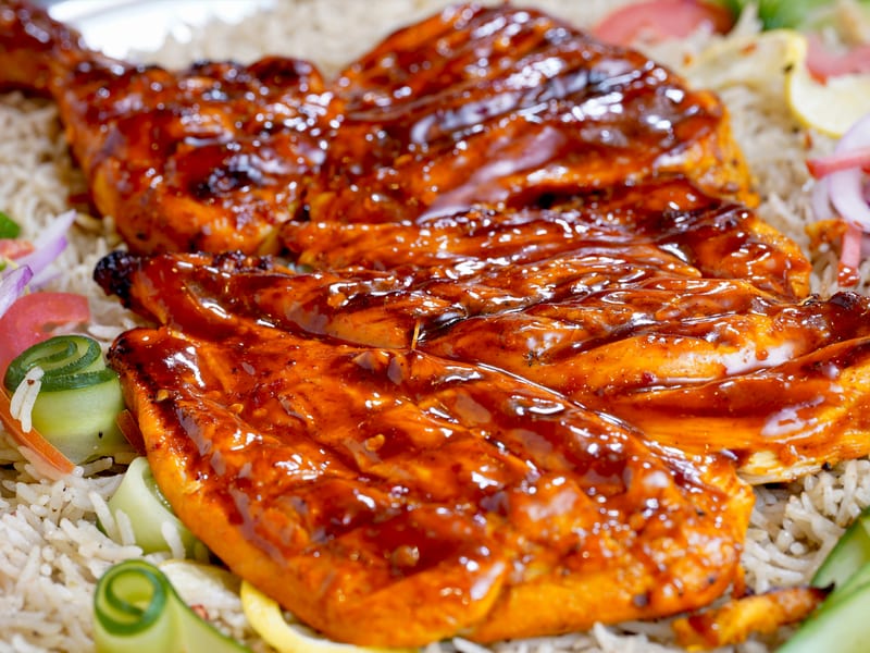 BBQ Mandi, Fragrant mandi rice enhanced with BBQ sauce, topped with grilled chicken, veggies and sauces, Sufraq Karachi