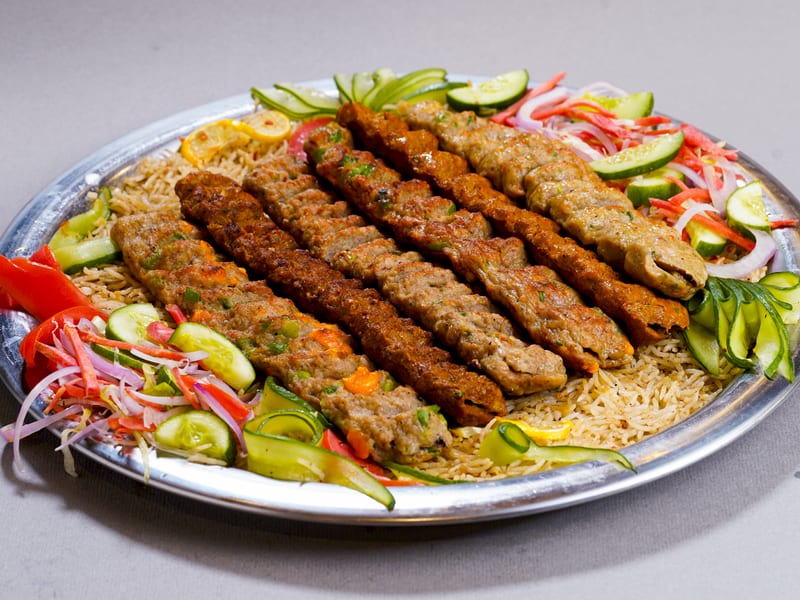 Sufraq Kebab Royal, a platter of charcoal-grilled kebabs over seasoned rice
