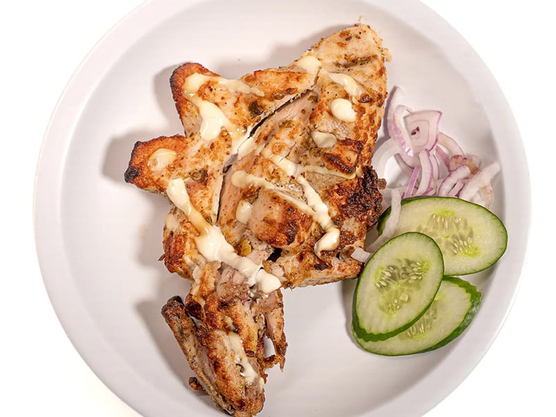 Malai Tikka Chest, Creamy marinated chicken, slow-grilled with a smoky char, Sufraq Karachi