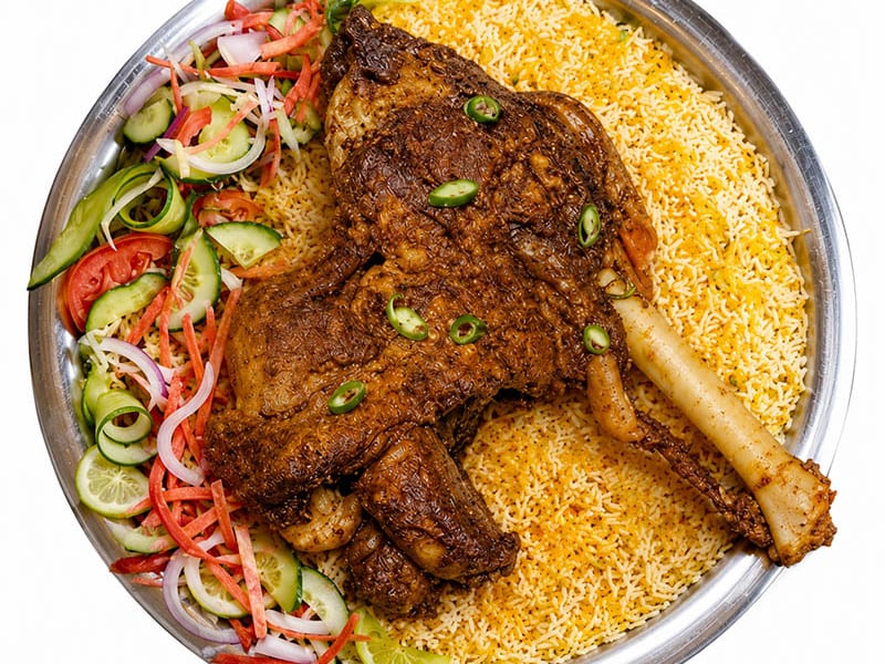 Mutton Mandi, Fragrant mandi rice topped with tender slow-cooked mutton, fresh vegetables and signature sauces, Sufraq Karachi