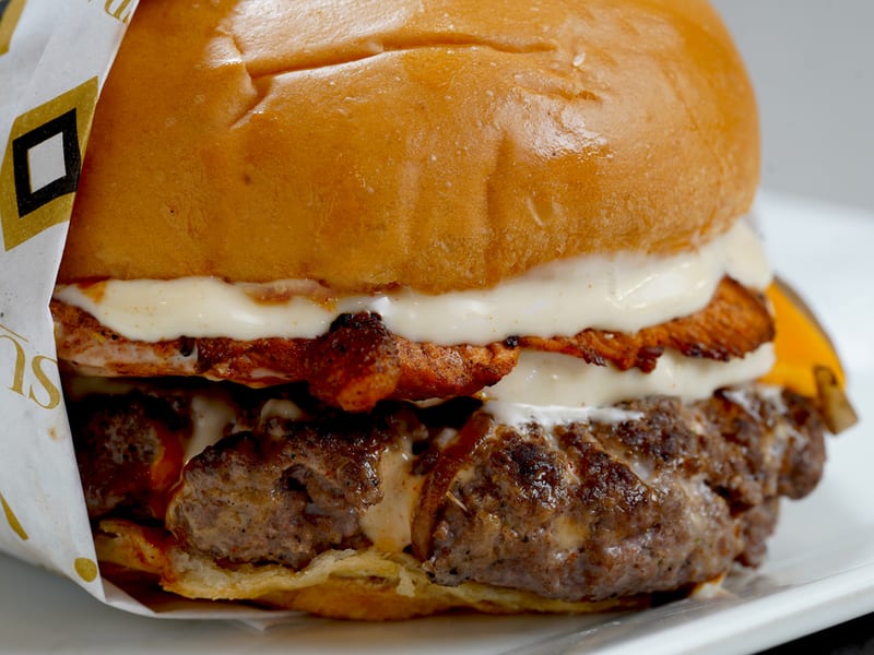 The Beast, A mighty combo of one chicken patty and one beef patty with cheese, garlic mayo and iceberg, Sufraq Karachi